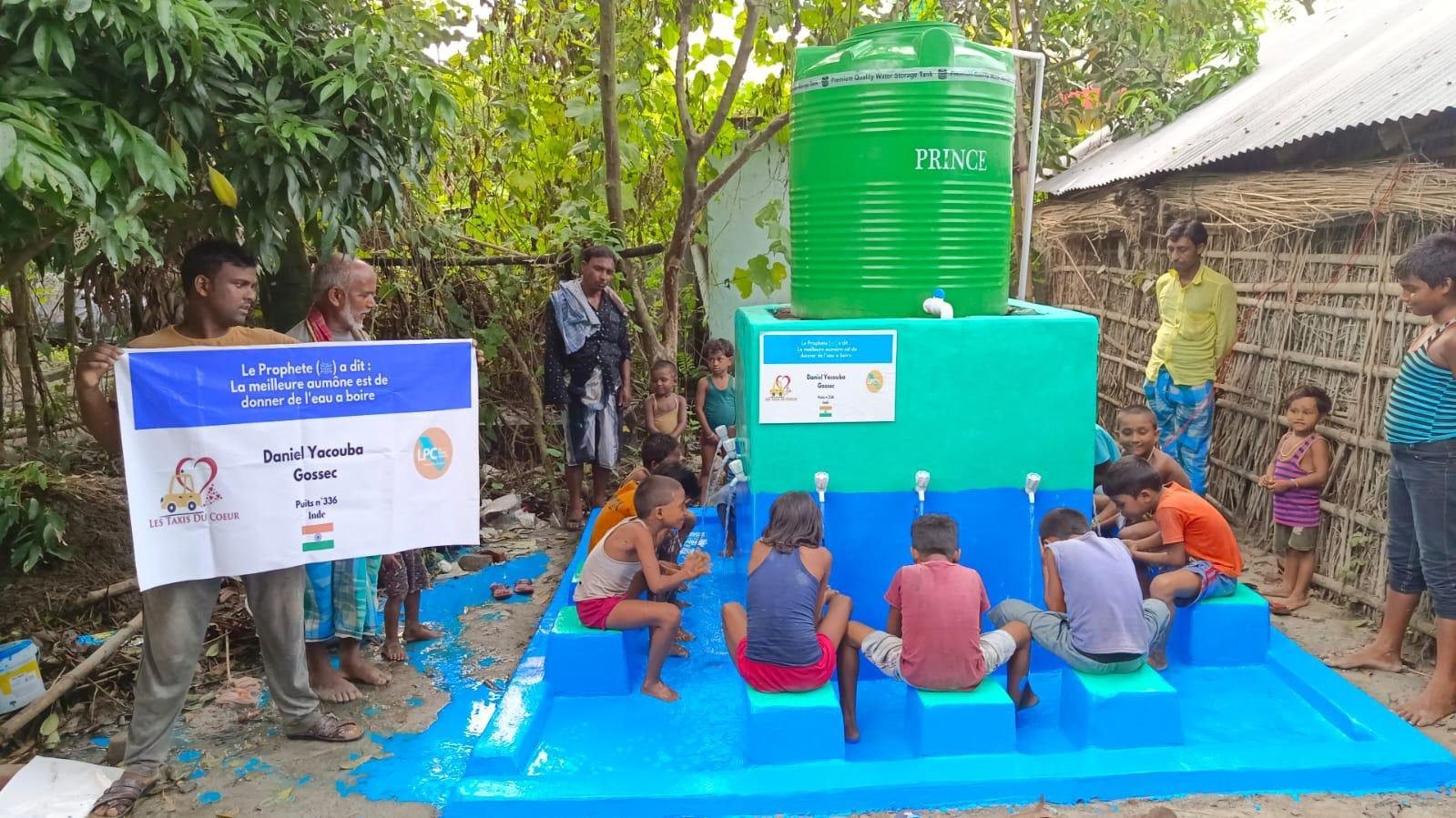 Children at a colourful drinking water point in India.