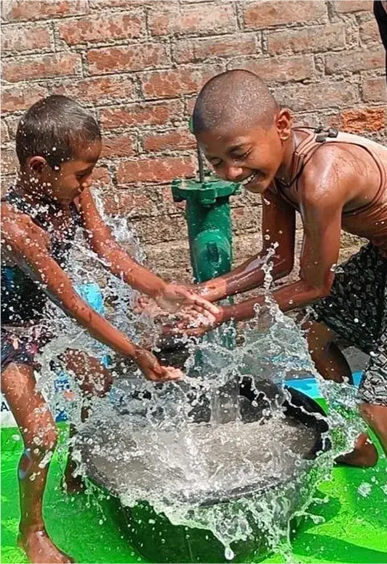 Children joyfully playing with water.